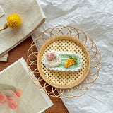 Cozy and Elegant: Knitted Flower Embellishment for Home Décor