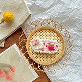 Cozy and Elegant: Knitted Flower Embellishment for Home Décor